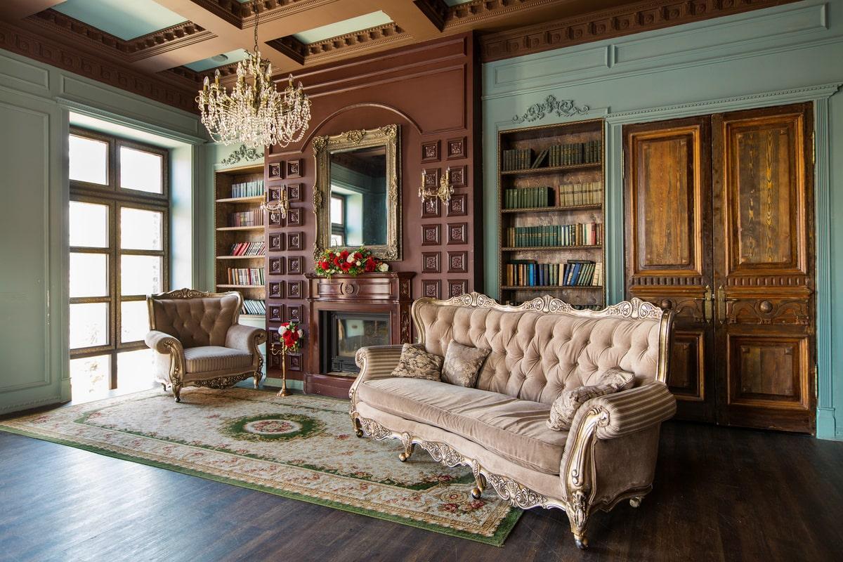 A modern library and sitting area decorated in a Victorian style.